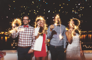 Group of people having a party on the roof celebrating New Year 