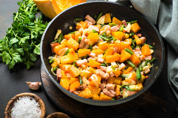 Pumpkin fried with vegetables and meat.