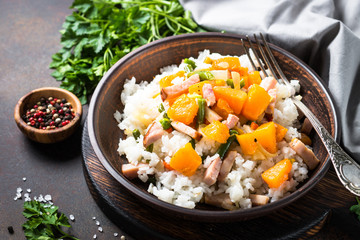 Risotto with pumpkin, vegetables and smoked meat,