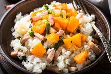 Risotto with pumpkin, vegetables and smoked meat,