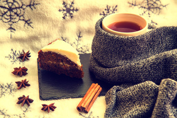 Tea with cake, cinnamon and anise