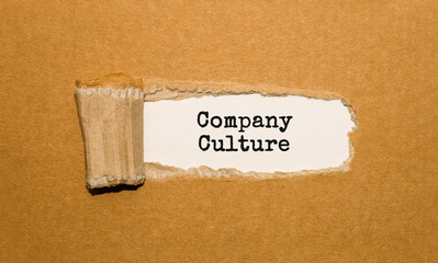 The text Company Culture appearing behind torn brown paper