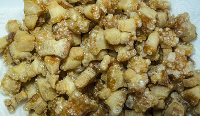 Cracking pork is crisped pork fat left in the pan after being fired for lard.