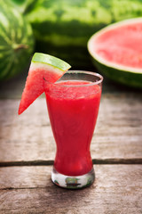 Watermelon juice in glass with watermelon slice
