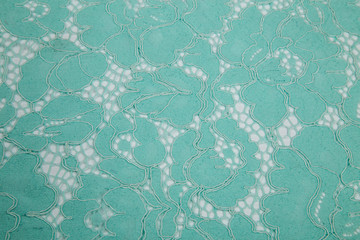 lace fabric guipure over white background turquoise color, delicate