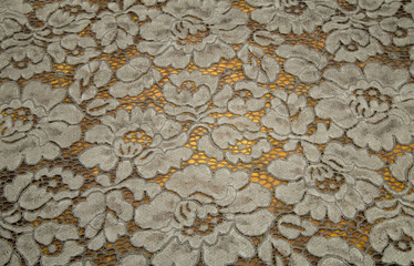 lace fabric guipure on the color of the khaki background, the delicate