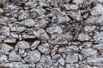 Ancient stone wall of a fortress as background