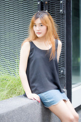 Beautiful young adult thai chinese bronze hair relax and smile