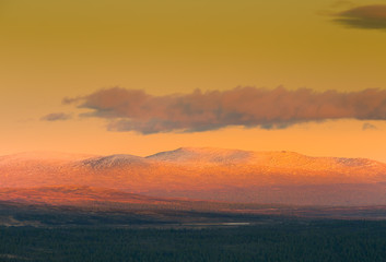 A beautiful, colorful sunset in mountains. Beautiful autumn in Norway. Abstract colorful look.