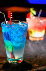 Blue cocktail with a slice of lemon