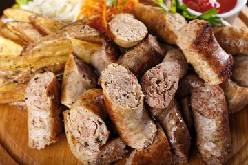 Assorted sausages with sauce