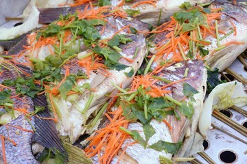 Obraz na płótnie Canvas Steamed fish at street food