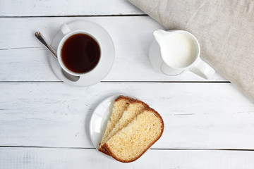 Cake with coffee cup. Top view