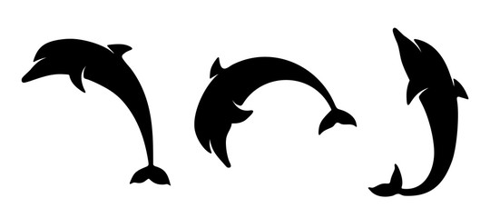 Obraz premium Wektor zestaw czarne sylwetki delfinów na białym tle na białym tle.