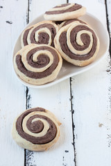 spiral  cookies on a white wooden background