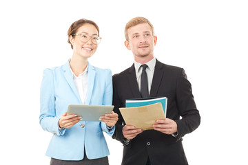 Portrait of Asian businesswoman and Caucasian businessman holding tablet computer and documents
