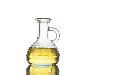 Small bottle of olive oil isolated in front of white background