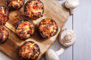 Baked champignon caps stuffed with minced meat