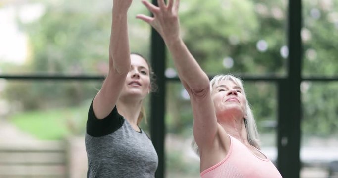 Senior Woman learning yoga