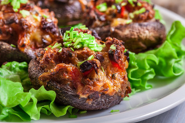Baked champignon caps stuffed with minced meat