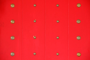 tradition chinese door with brass knot on red wooden panel background