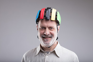smiling old man wearing a bike helmet