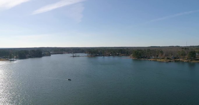 Aerial drone footage over a lake in the mountains