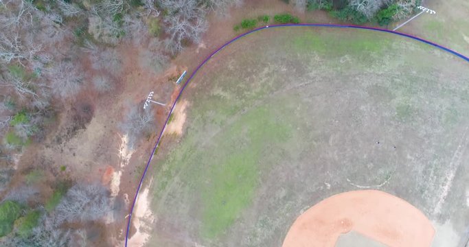 Aerial Drone footage flying over a baseball field