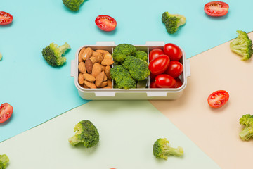 Healthy lunch box with sandwich and fresh vegetables, bottle of water. Healthy eating concept. Top view