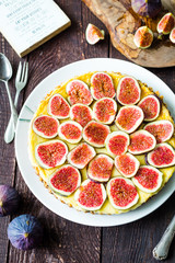 Homemade Cake with Fresh Figs and Goat Cheese on Brown Rustic Wooden Table, Vertical Top View