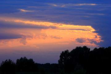 Fototapeta na wymiar Set sunset background. Sky, clouds in field. Nature.