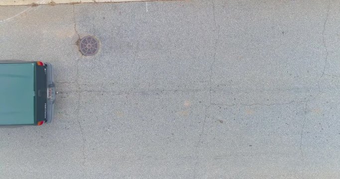 Cars driving under a drone shot
