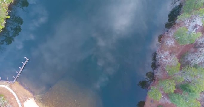 Aerial drone footage over a lake in the mountains