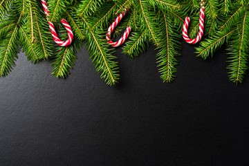 Christmas background with candy canes and christmas tree.