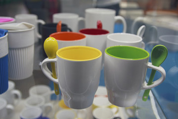 Varied mugs on the counter of the store. Sales