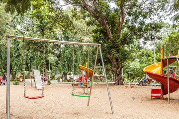 Isolated swinger in an outdoor environment for kids to play.