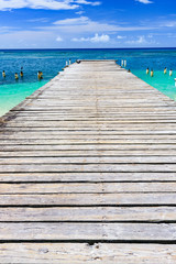 Fototapeta premium wooden bridge juts out into of the sea Dominican Republic