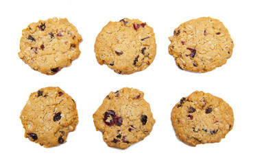 Six oatmeal cookies with cranberries isolated on the white background