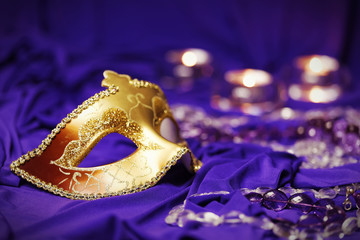 Colorful Mardi Gras or Carnival masks group on a purple background