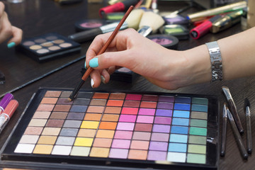 colorful eyeshadow palette and the hand of the master