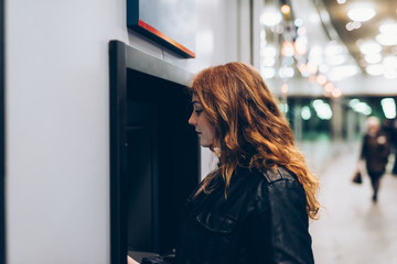 young woman beautiful using atm machine - customer, buying, transaction concept