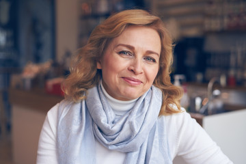 Happy mature woman looking at camera