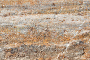 Stone texture background; natural rock texture. Abstract background and texture for designers. Close up of stone surface background.surface of the stone with brown tint..