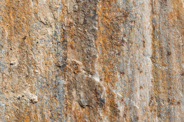 Stone texture background; natural rock texture. Abstract background and texture for designers. Close up of stone surface background.surface of the stone with brown tint..