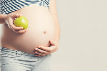 Pregnant girl with Apple