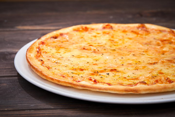 pizza on the wooden background