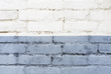 divide old white and blue bricks wall background divided horizontally