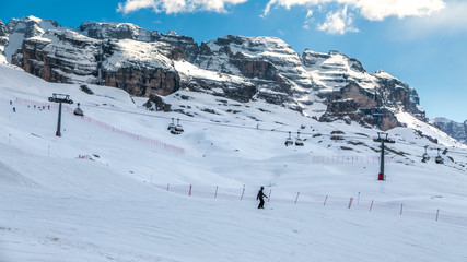 Fototapeta na wymiar Madonna di Campiglio, Italy - April 24th, 2017: Man skiing from