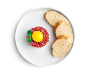Plate with delicious steak tartare and bread on white background