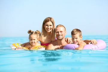 Fototapeta na wymiar Happy family resting at sea resort